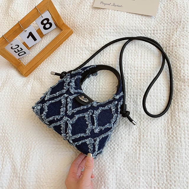 Small quilted raw hem mini crossbody bag.