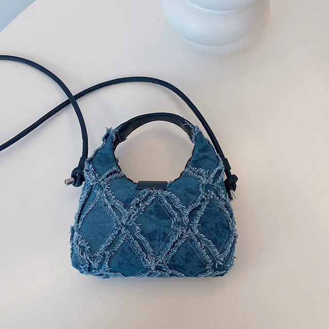 Small quilted raw hem mini crossbody bag.