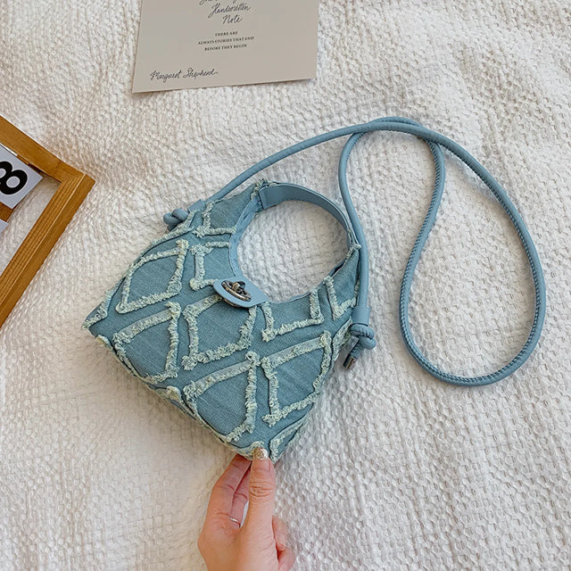 Small quilted raw hem mini crossbody bag.