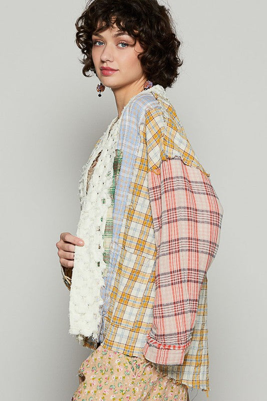Raw edge plaid open front cardigan with exposed seams.