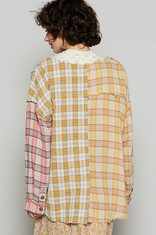 Raw edge plaid open front cardigan with exposed seams.