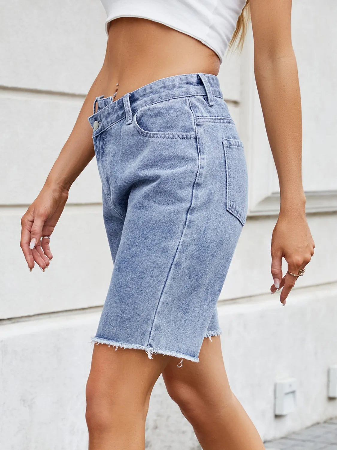 High waist criss-cross waistband denim shorts with pockets.