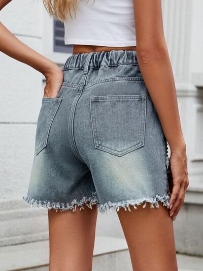 High rise denim shorts with cargo pockets.