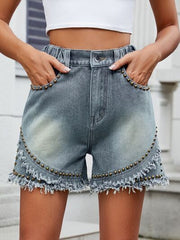 High rise denim shorts with cargo pockets.