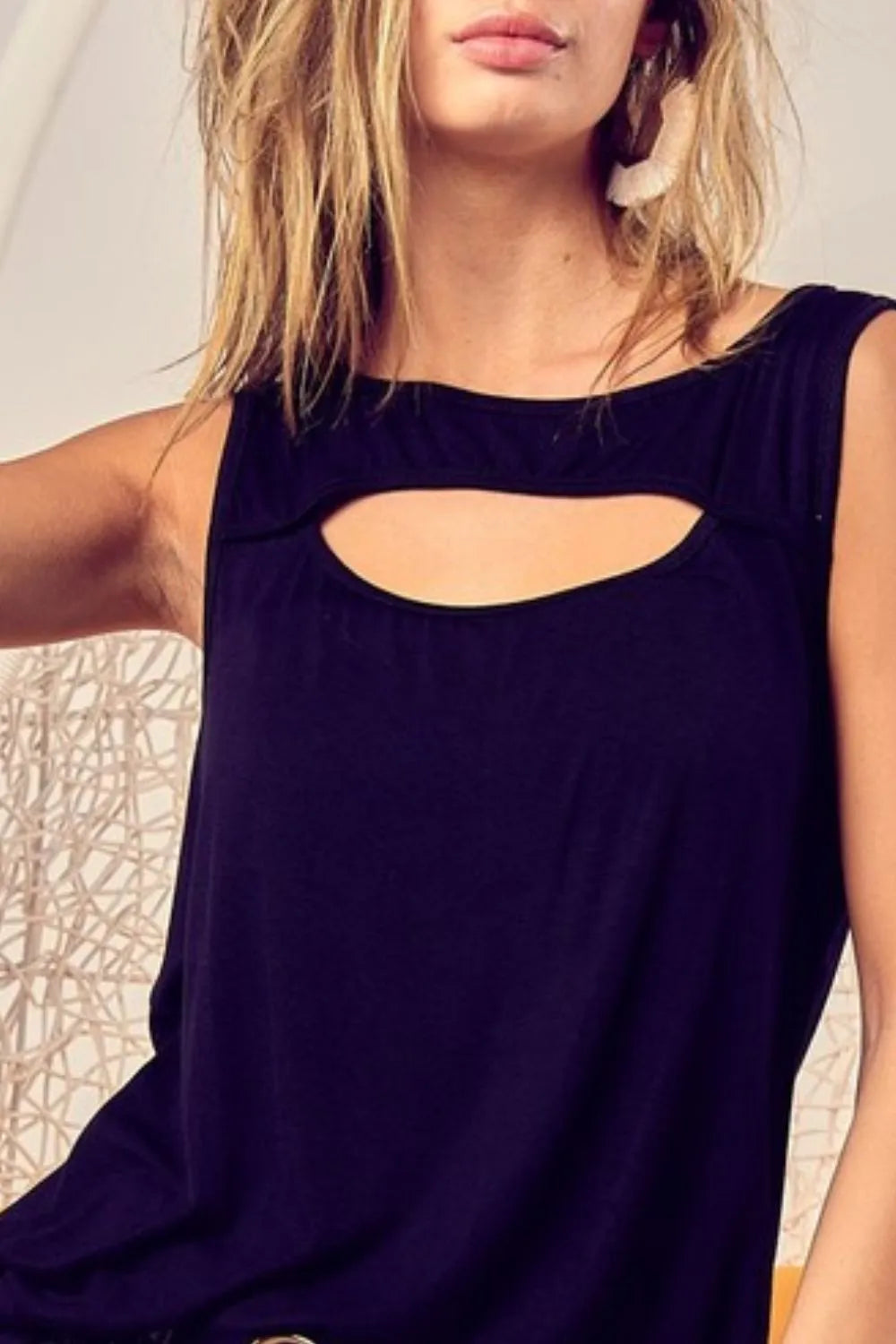 Rayon span knit sleeveless top with cut out front, slightly stretchy.