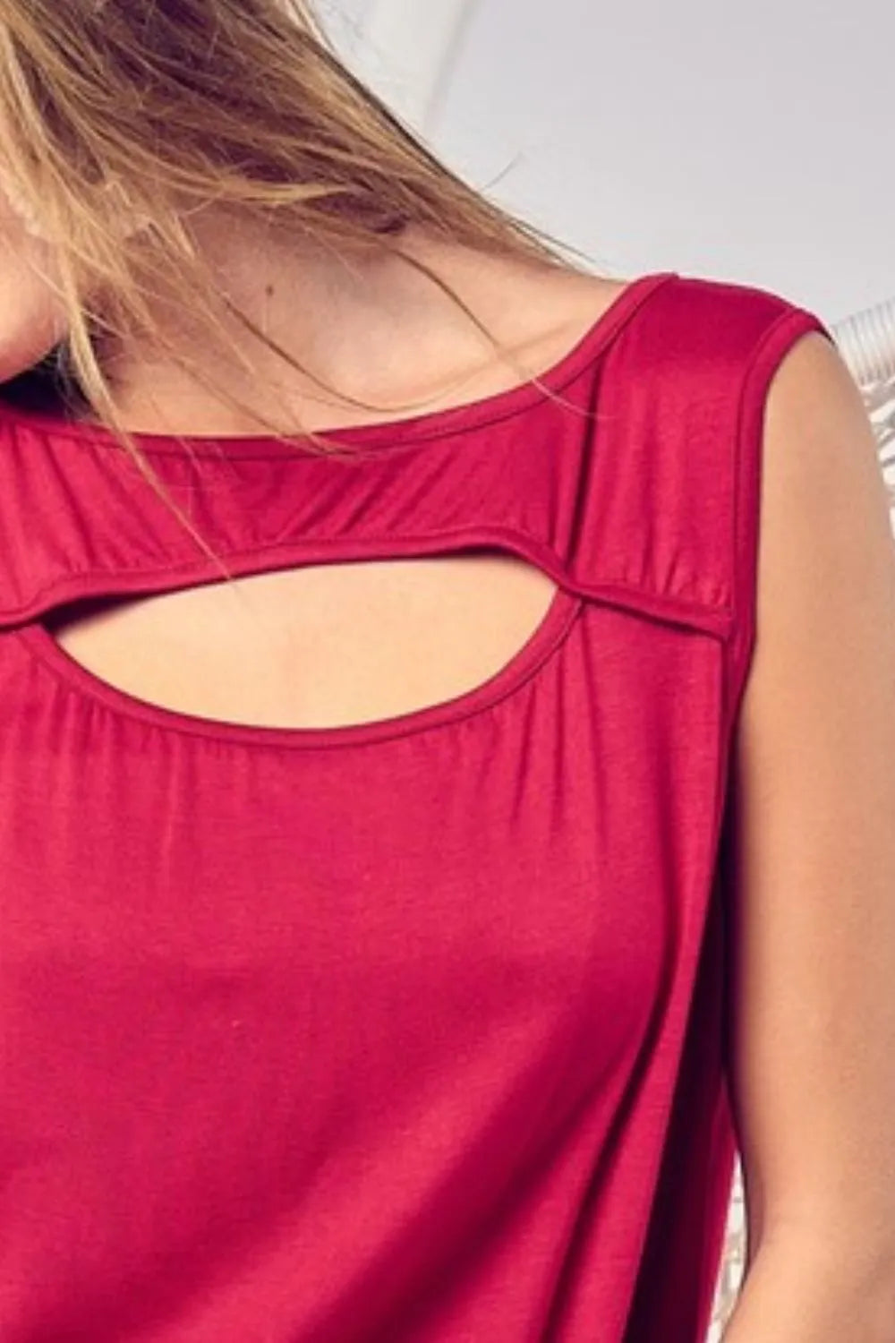 Rayon span knit sleeveless top with cut out front, slightly stretchy.