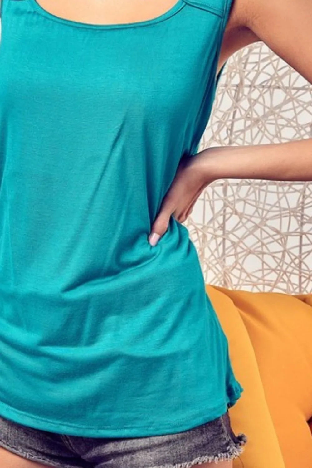 Rayon span knit sleeveless top with cut out front, slightly stretchy.