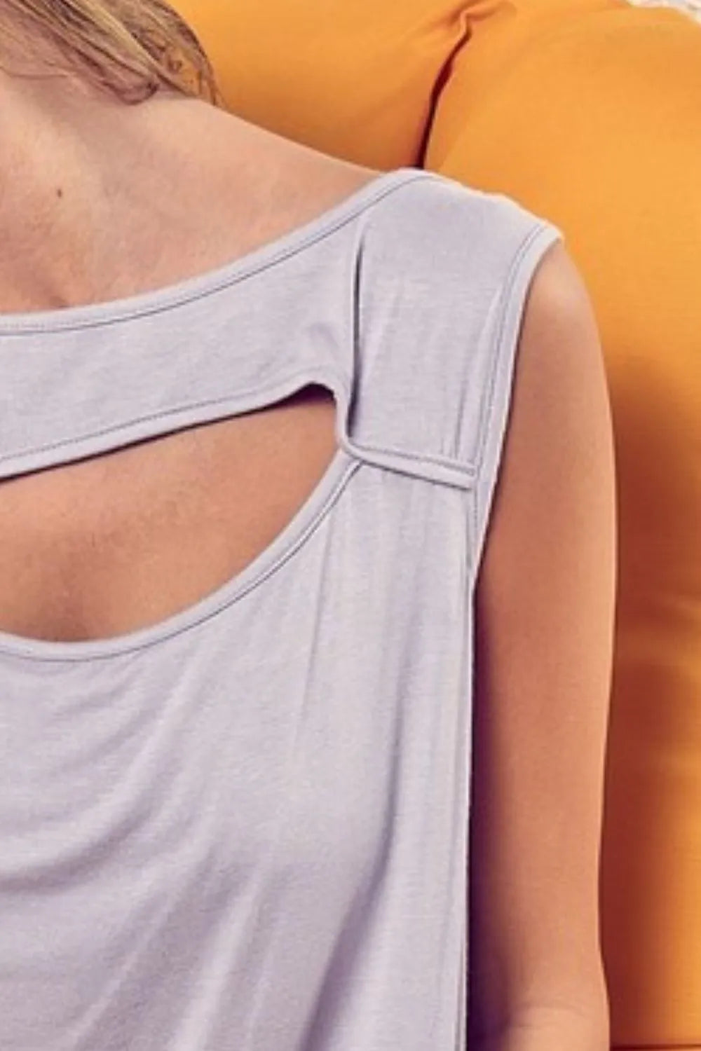 Rayon span knit sleeveless top with cut out front, slightly stretchy.