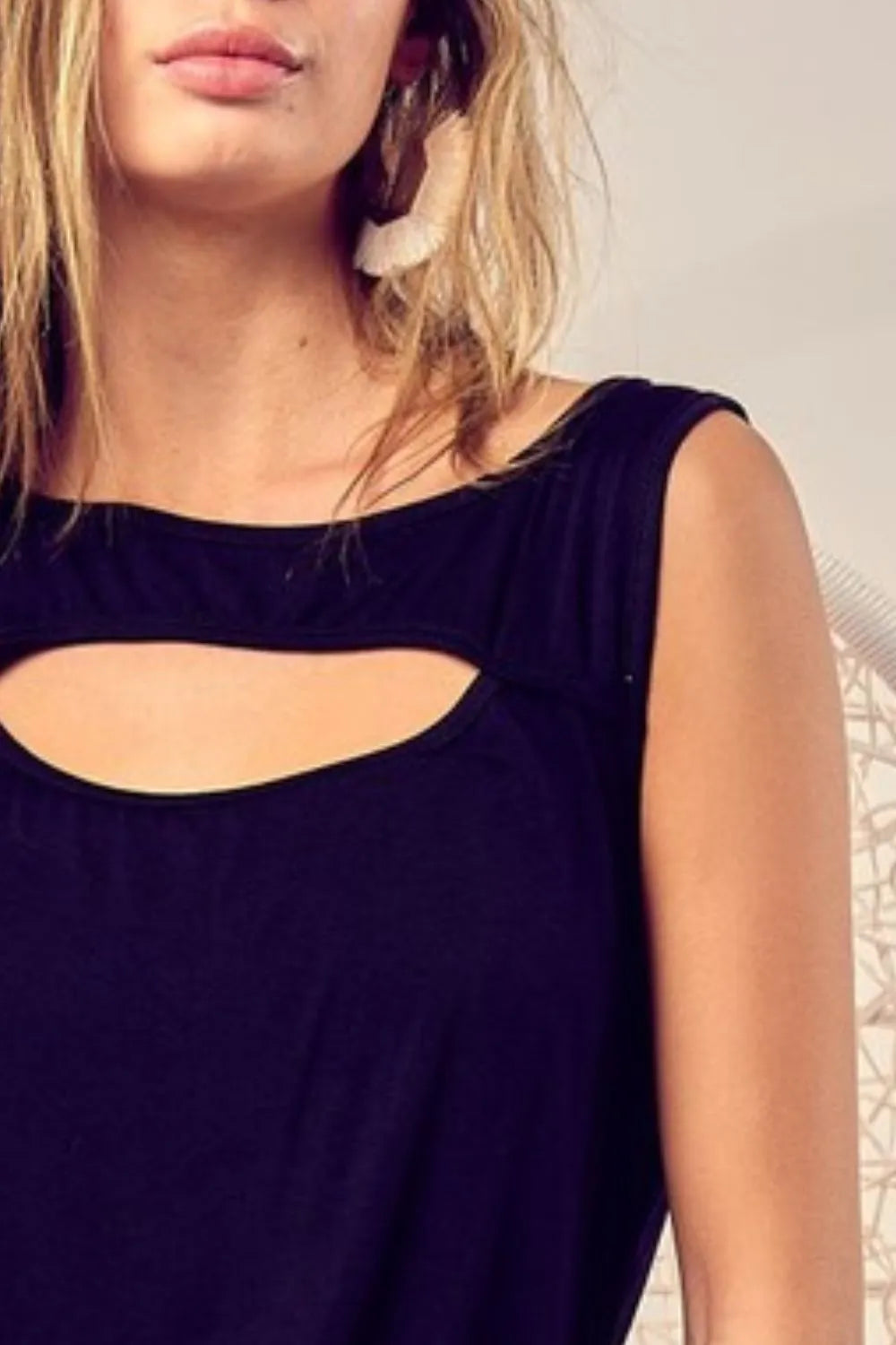 Rayon span knit sleeveless top with cut out front, slightly stretchy.