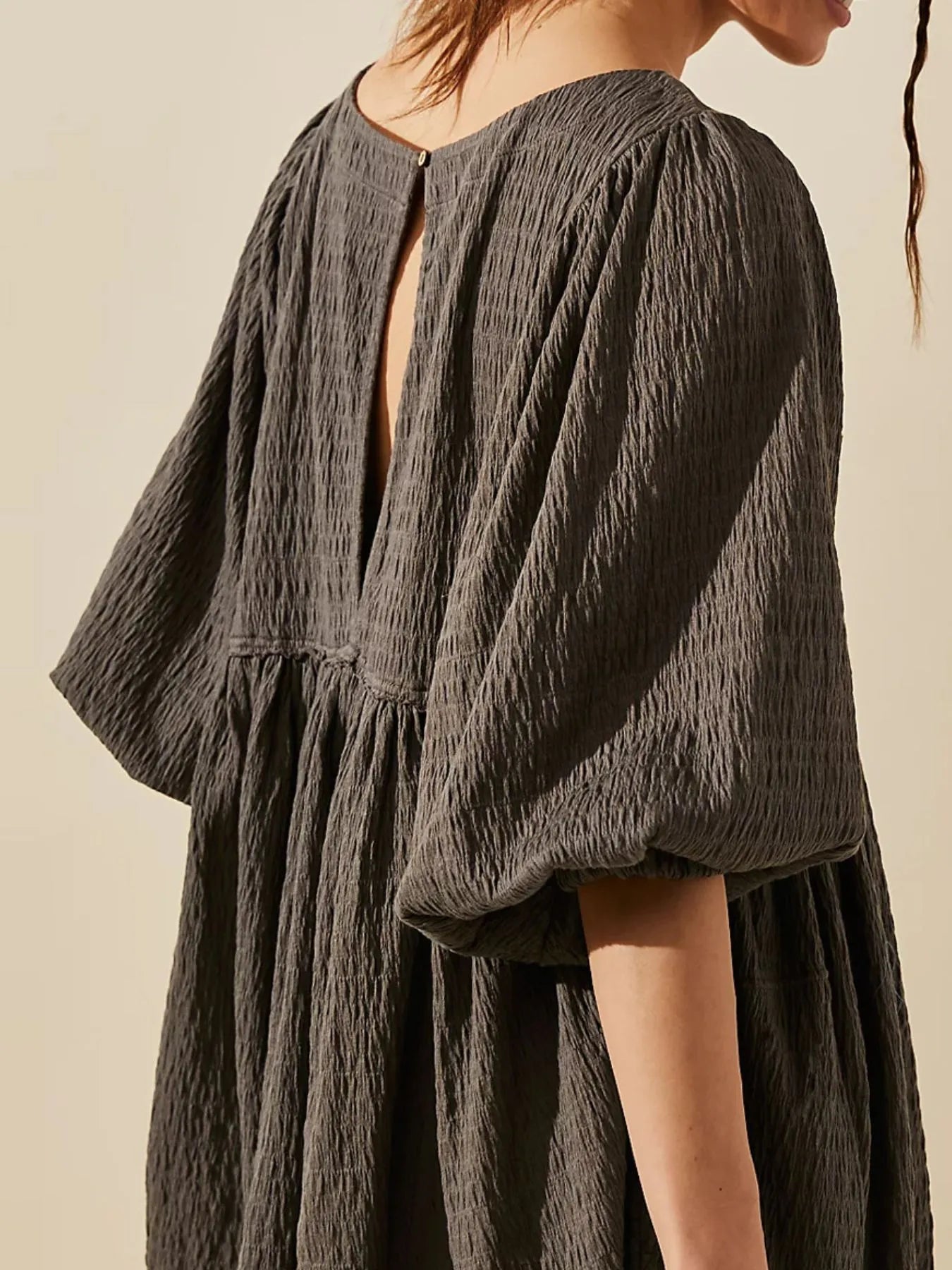 Relaxed Textured Babydoll Mini Dress with Back Keyhole Detail.