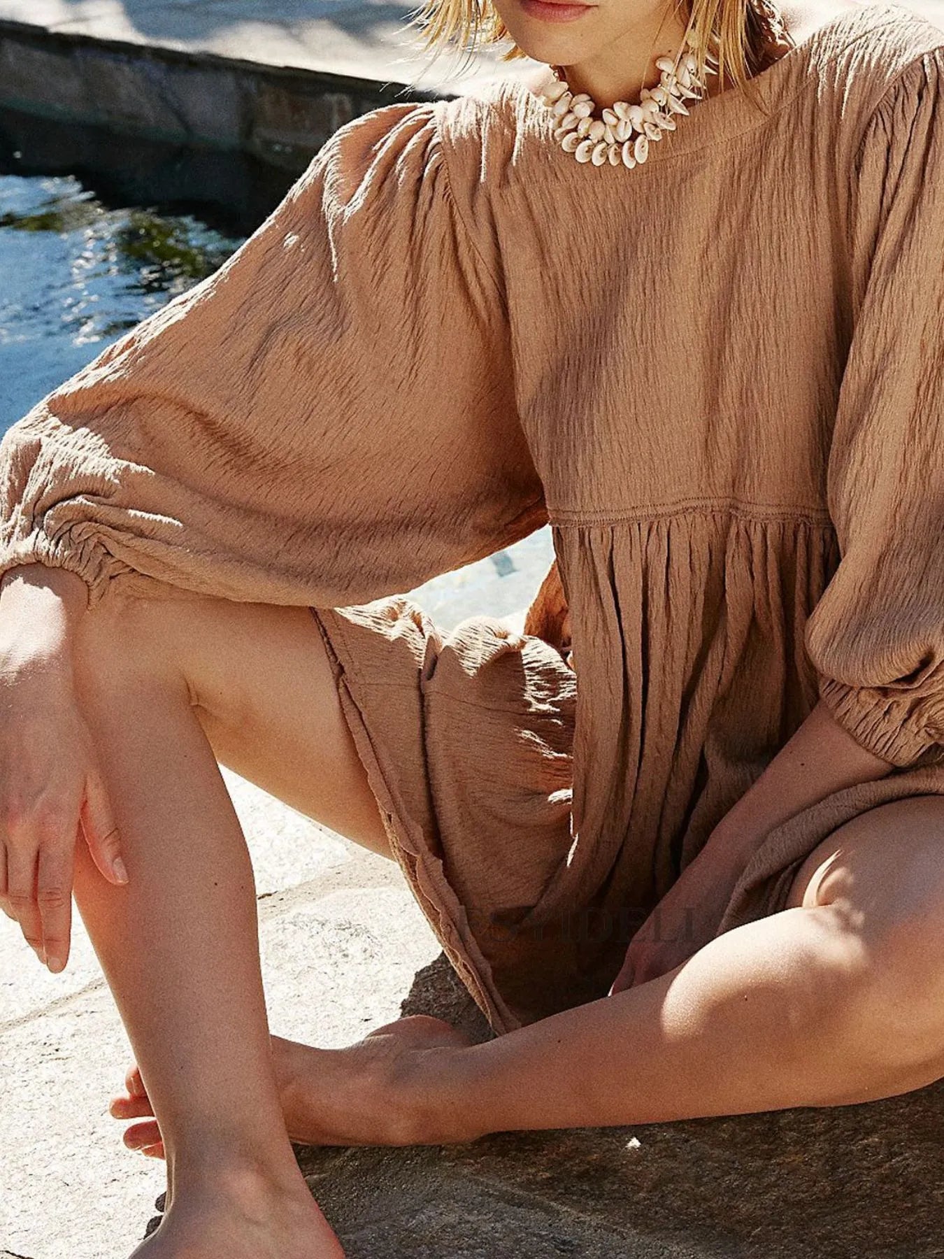 Relaxed Textured Babydoll Mini Dress with Back Keyhole Detail.