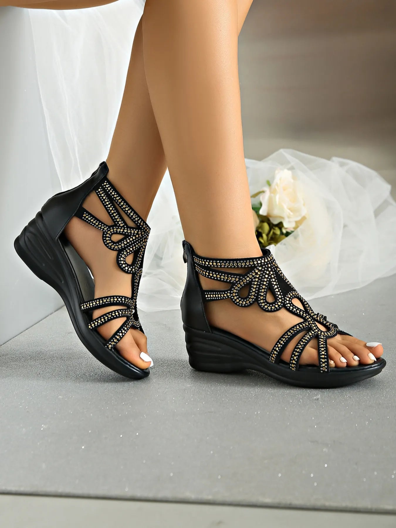 Rhinestone open toe low heel wedge sandals.