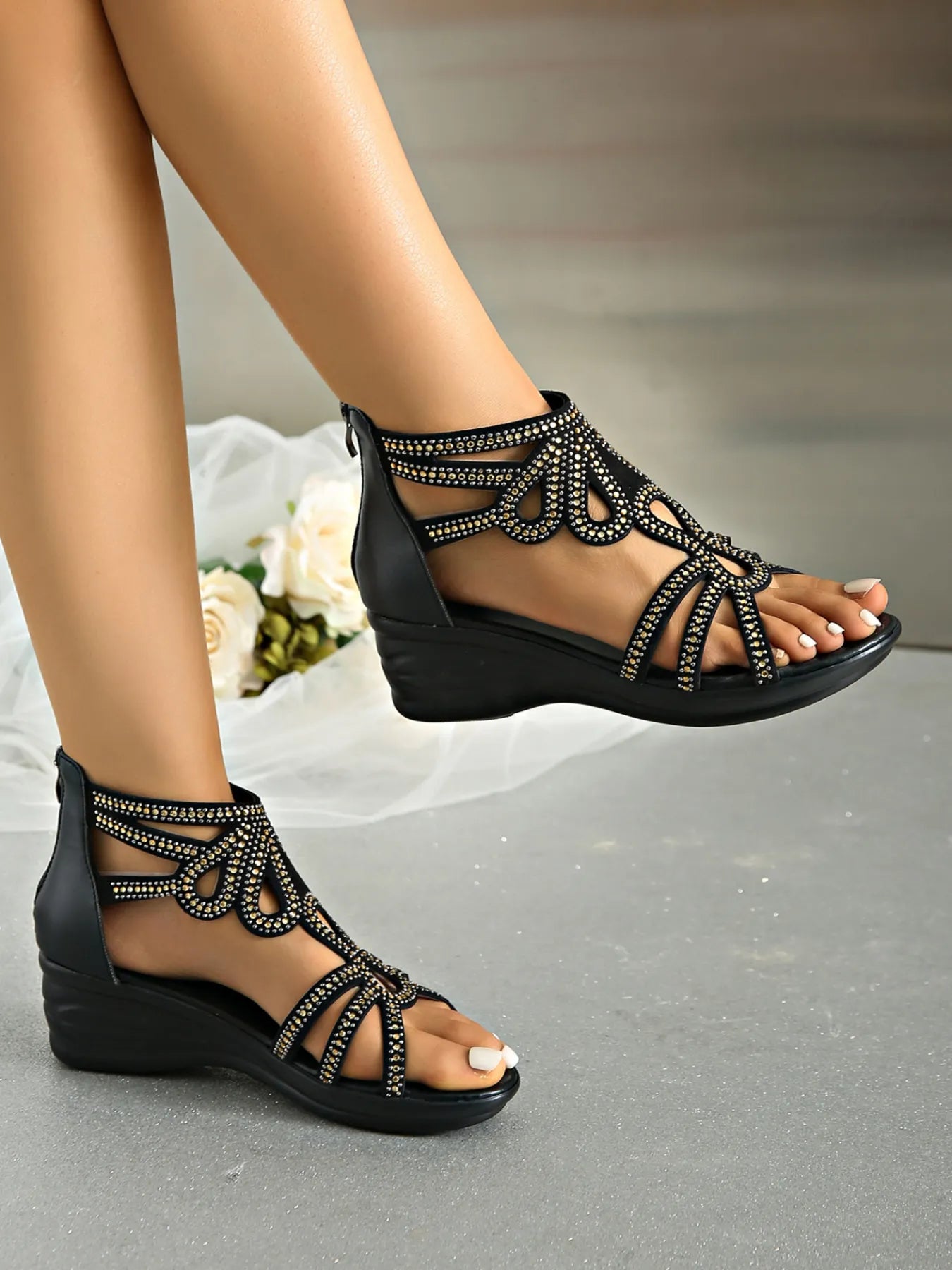 Rhinestone open toe low heel wedge sandals.