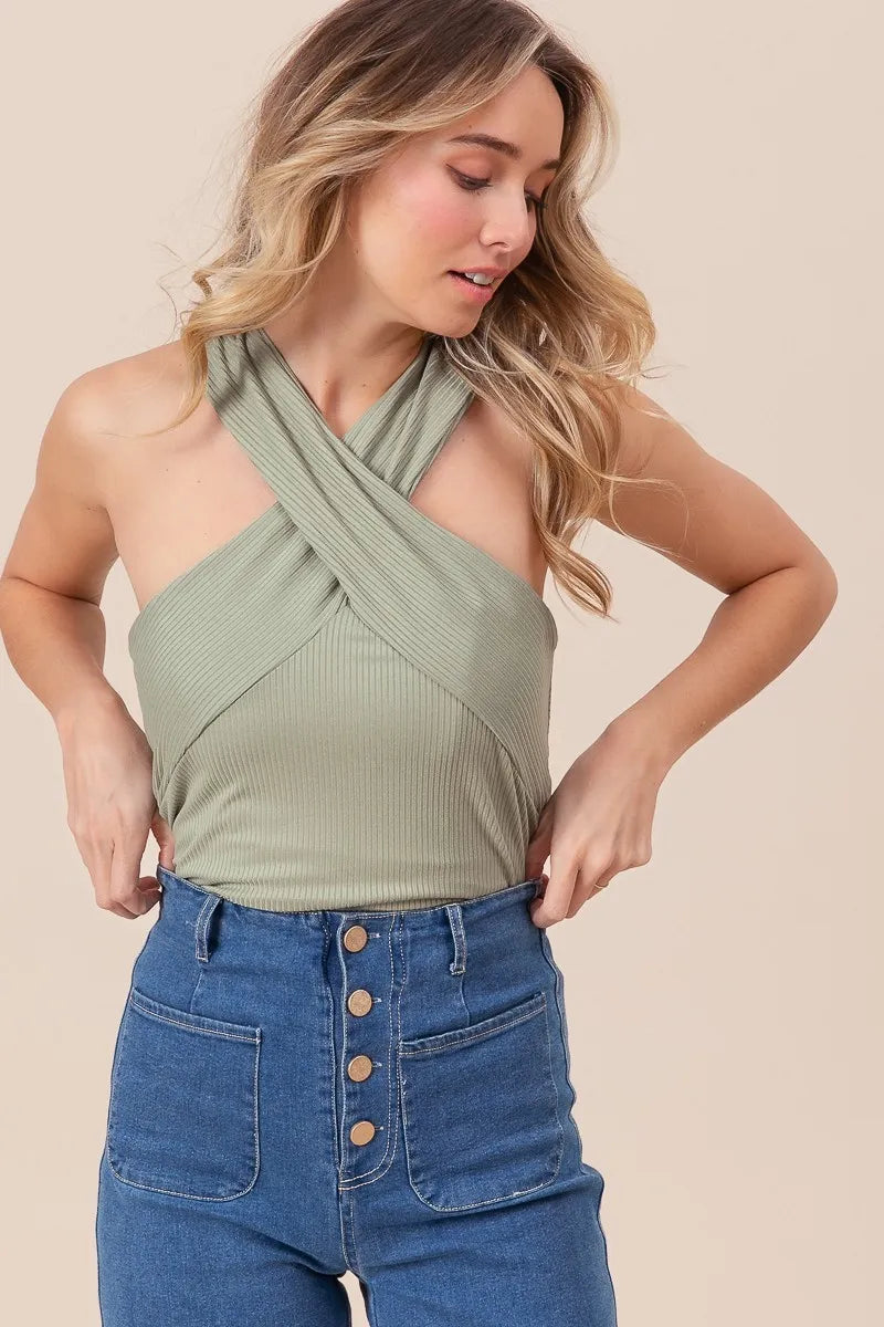 Rib knit cross neck banded top, ribbed and moderately stretchy.