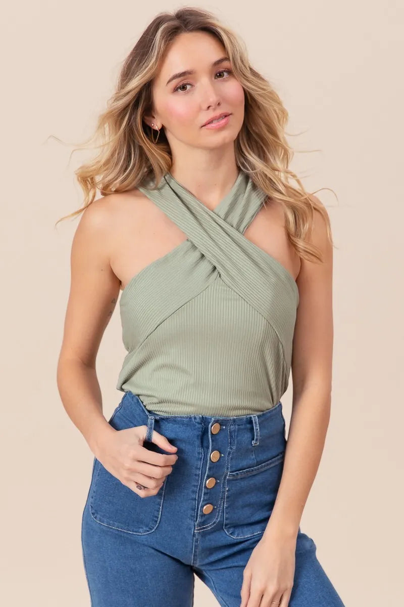 Rib knit cross neck banded top, ribbed and moderately stretchy.