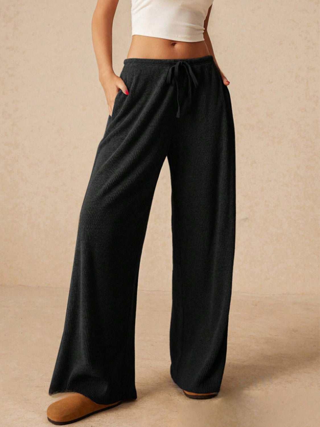 Ribbed drawstring wide leg pants with pockets, opaque.