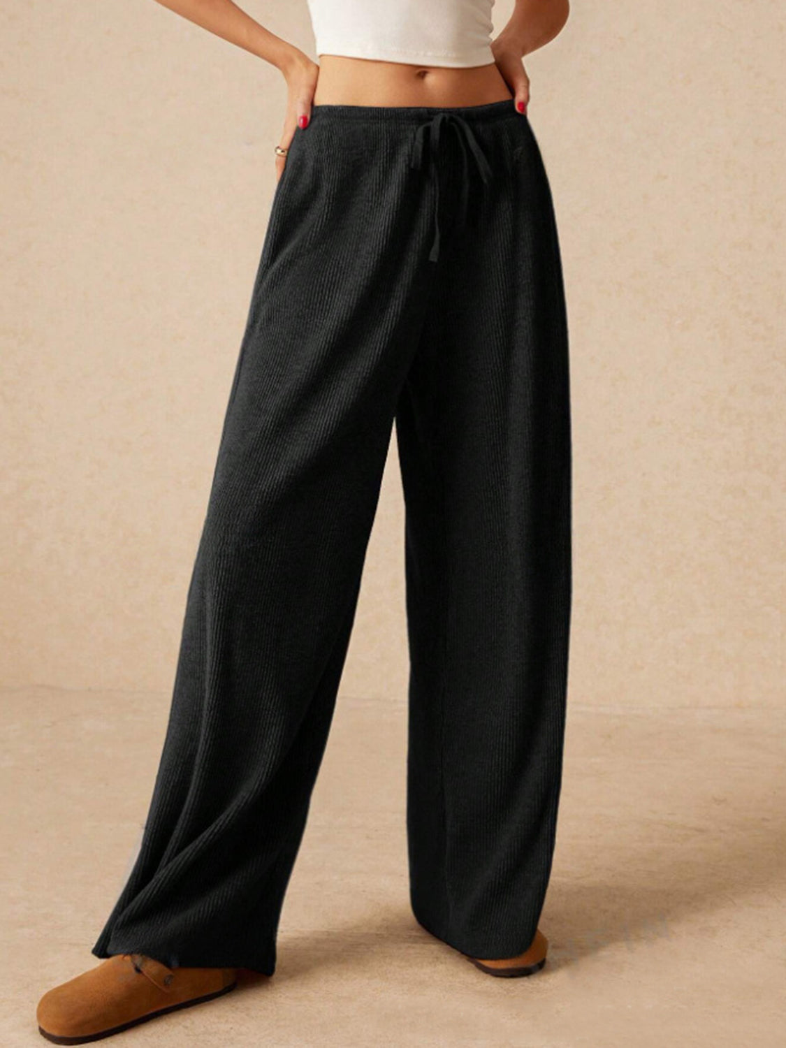 Ribbed drawstring wide leg pants with pockets, opaque.