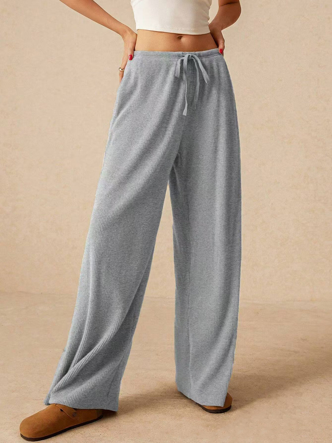 Ribbed drawstring wide leg pants with pockets, opaque.