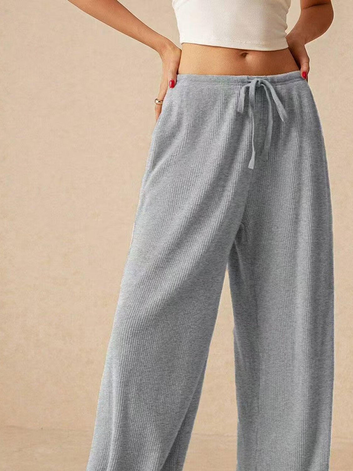 Ribbed drawstring wide leg pants with pockets, opaque.