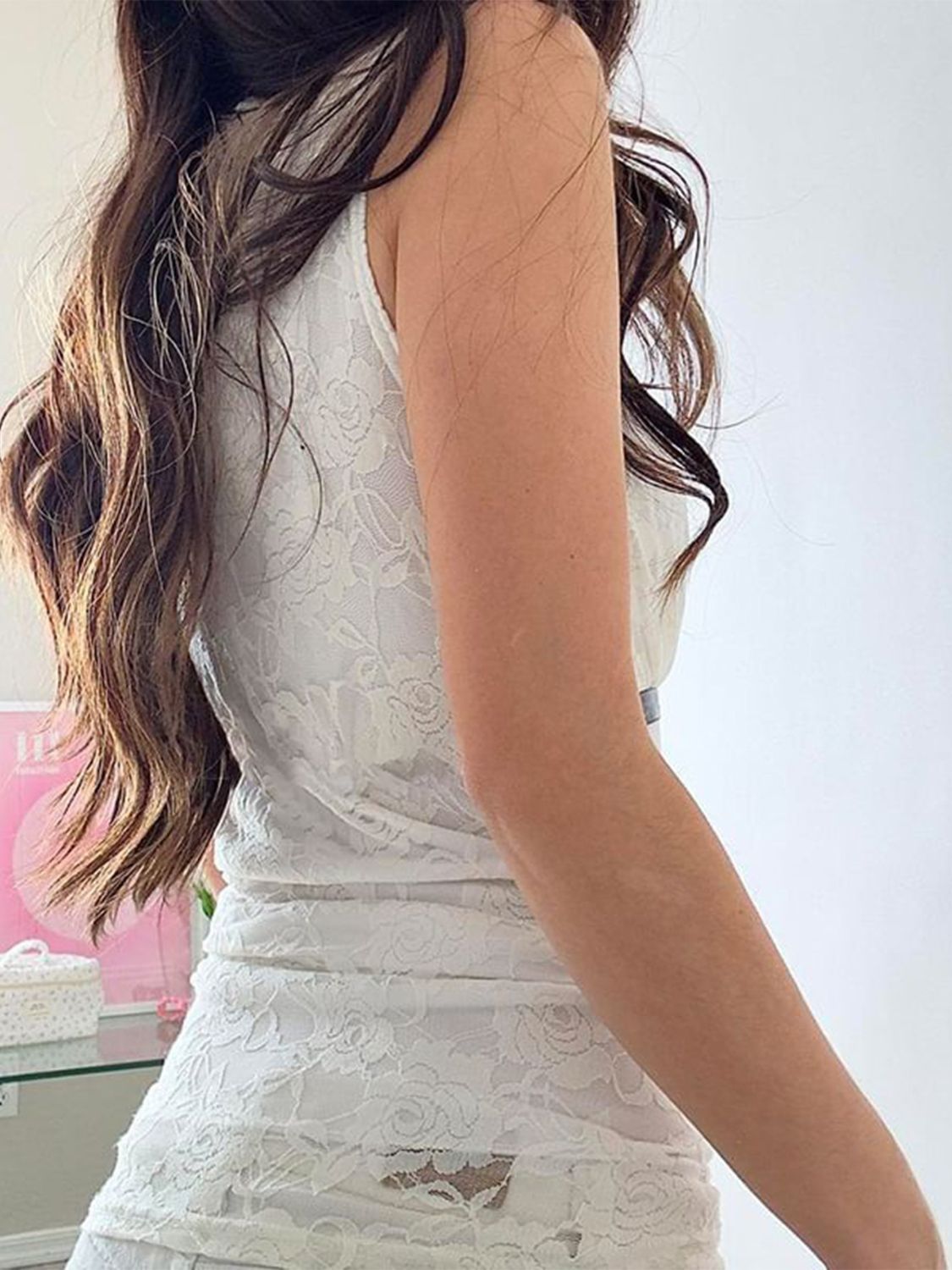 Ribbon tied lace surplice tank top.
