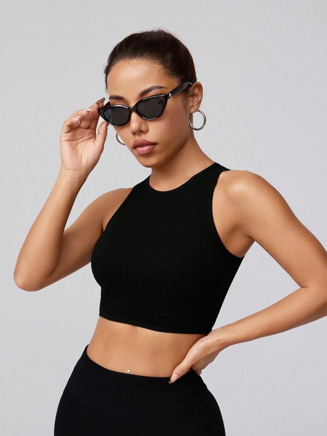 Round neck active tank, opaque and moderately stretchy.