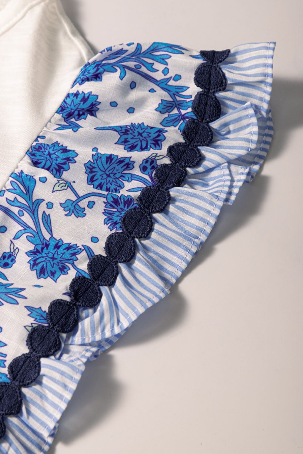 Round Neck Printed Ruffled Cap Sleeve Blouse.