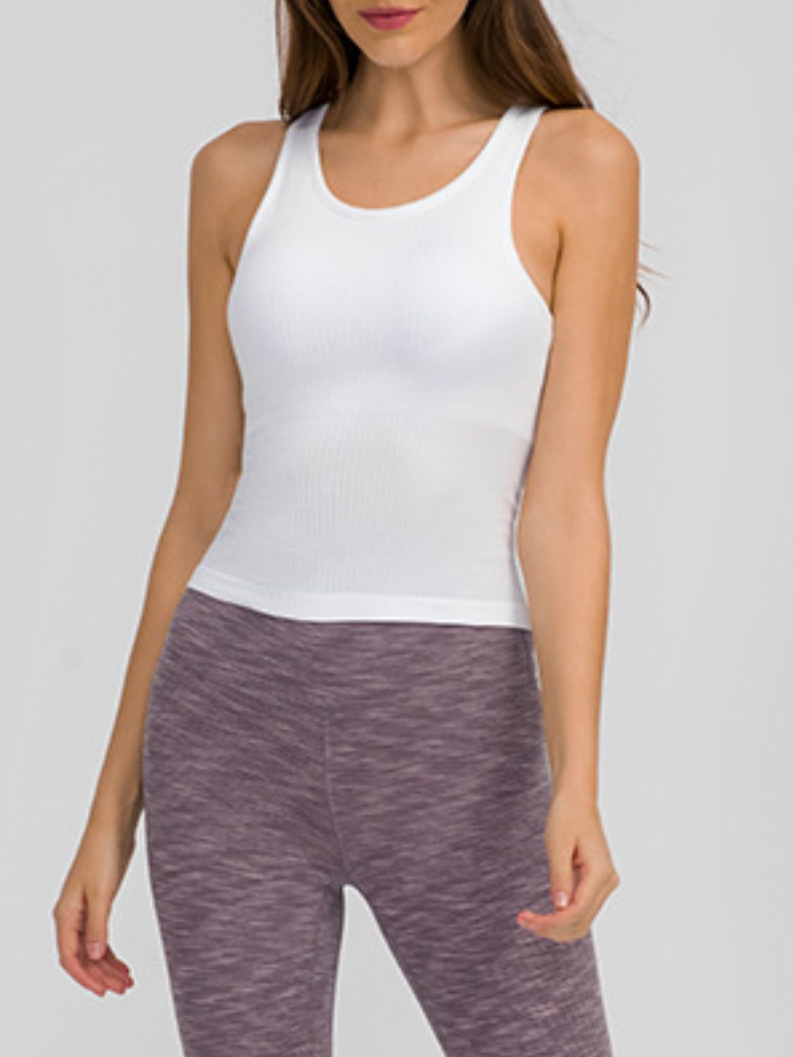 Round neck racerback active tank with removable padding.