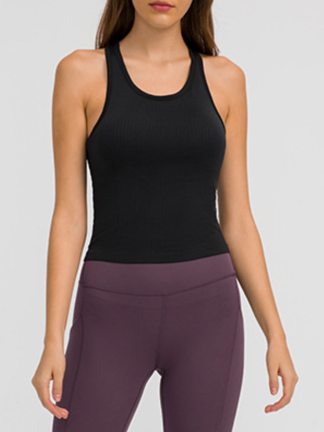 Round neck racerback active tank with removable padding.