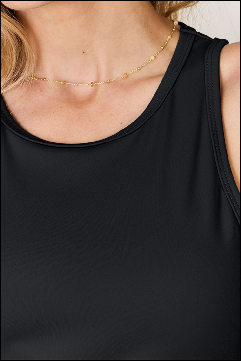 Full size round neck racerback tank top.