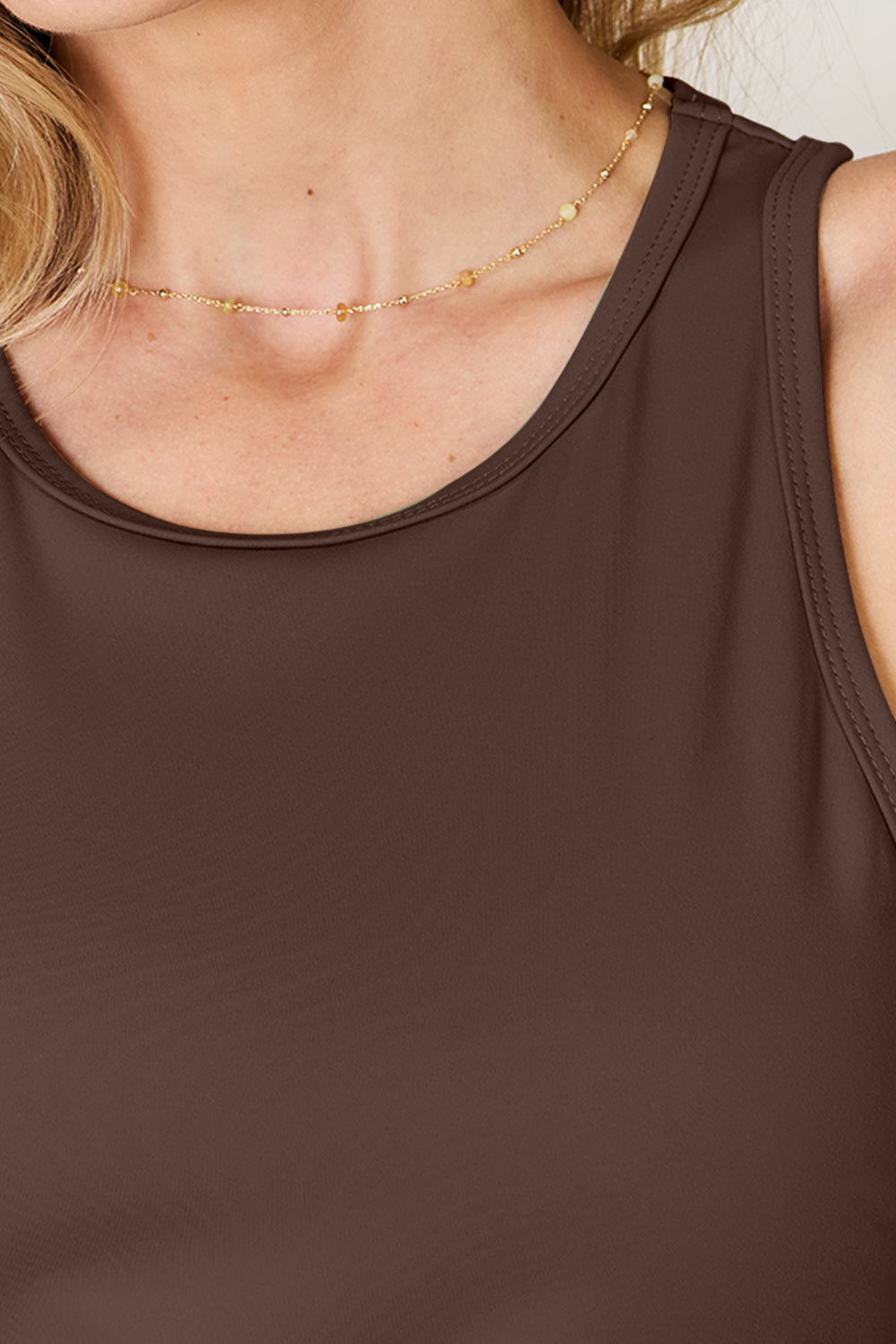 Full size round neck racerback tank top.