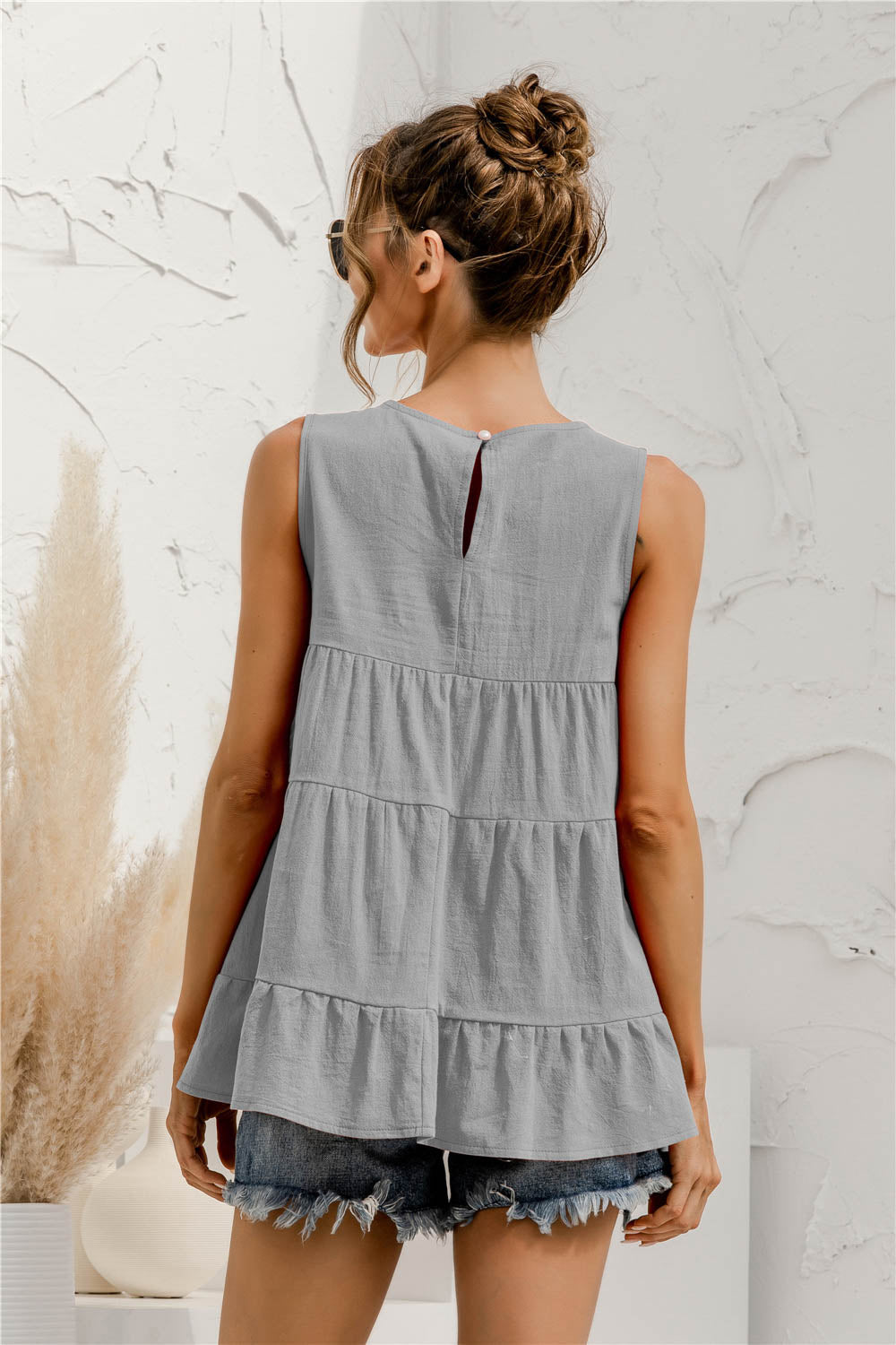 Round neck tiered babydoll tank top.