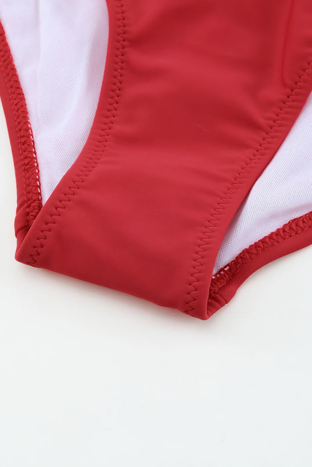 Printed and striped ruched bikini set with mid-waist bottoms and no padding.