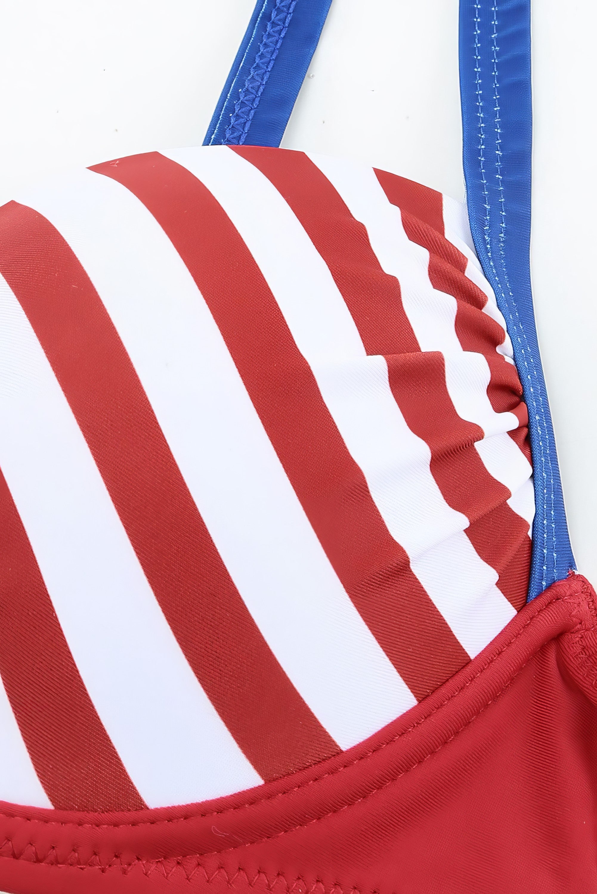 Printed and striped ruched bikini set with mid-waist bottoms and no padding.