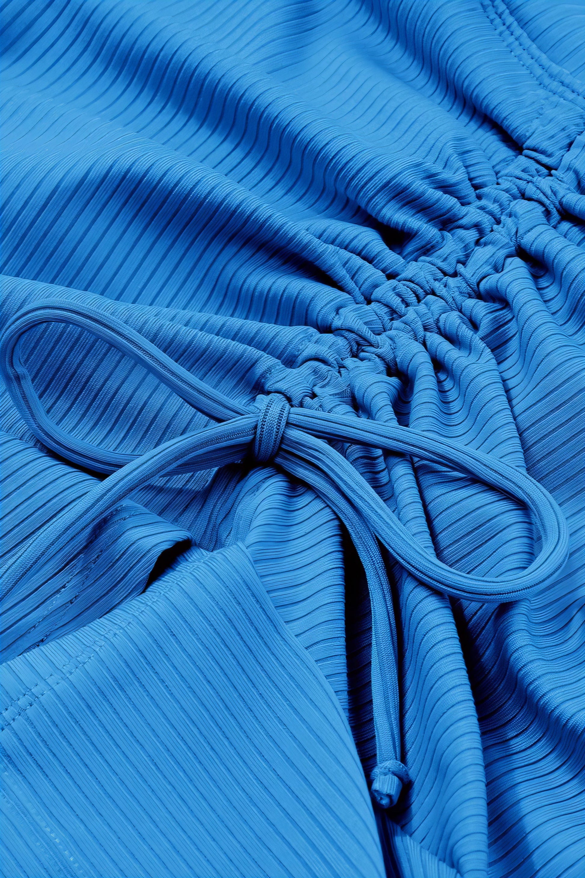 Ruched Swim Skirt. Sky Blue ruffled swim skirt with elastic waist and drawstring. Women's swimwear bottoms.