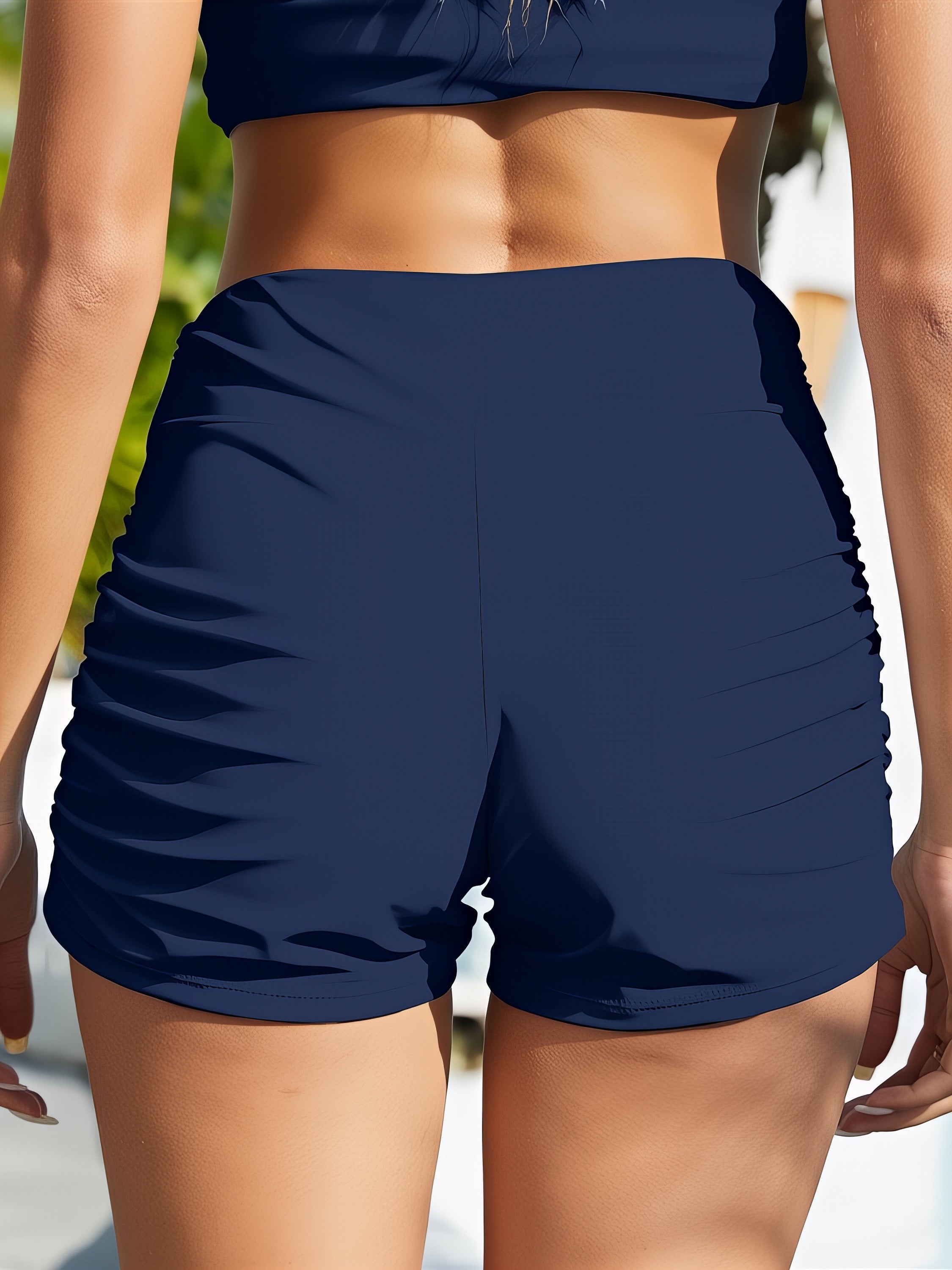 Ruched Mid-Rise Swim Shorts. Women's comfortable, stylish dark blue swim shorts. Perfect for swimming and beach days.