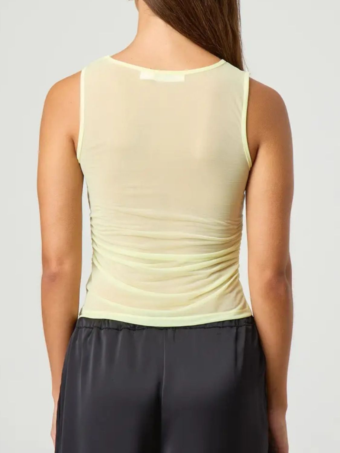 Ruched round neck tank top with semi-sheer design.