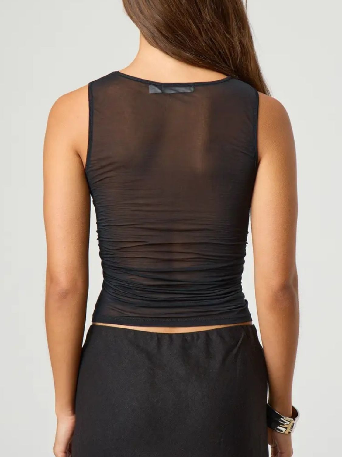 Ruched round neck tank top with semi-sheer design.