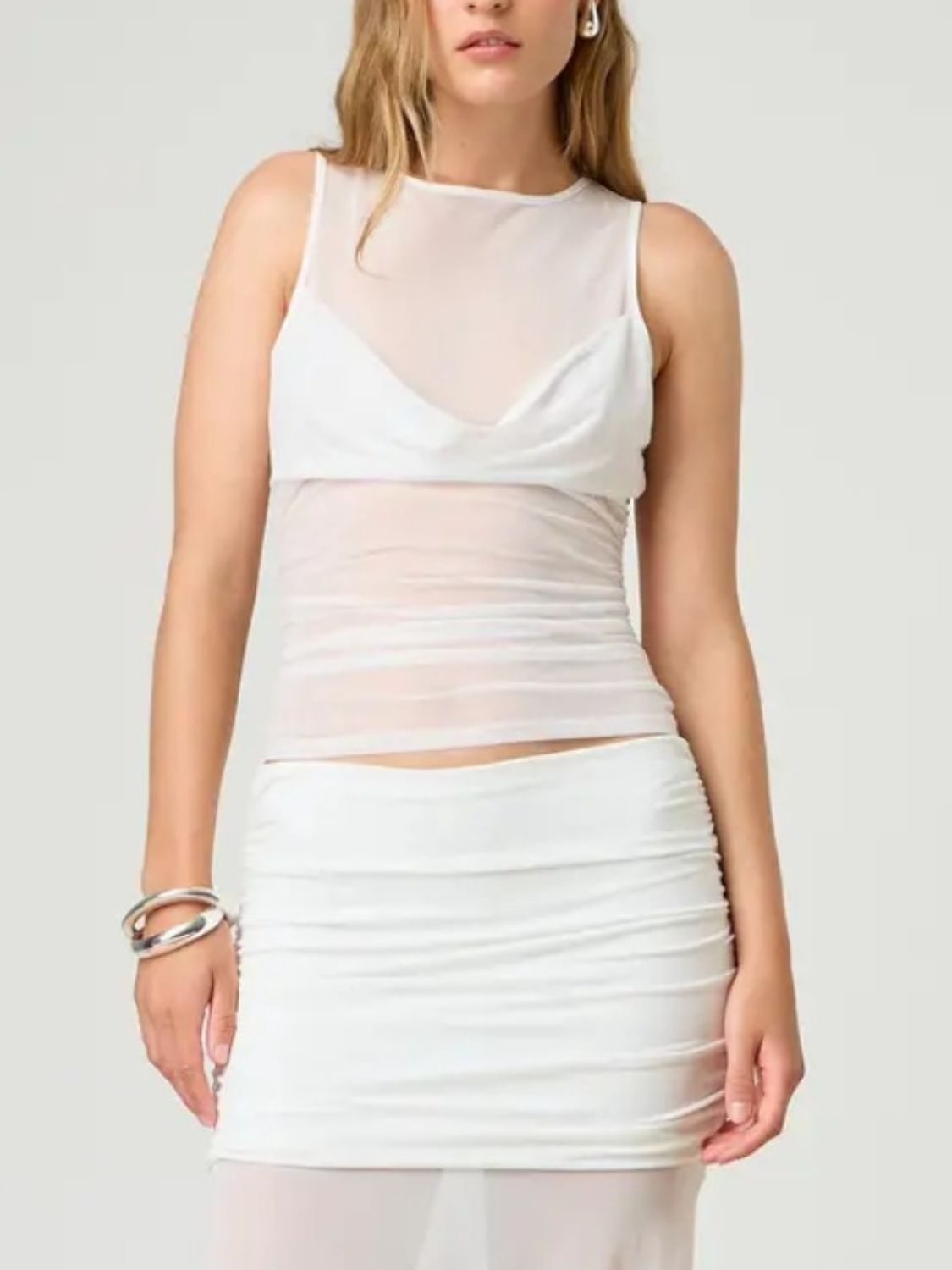Ruched round neck tank top with semi-sheer design.