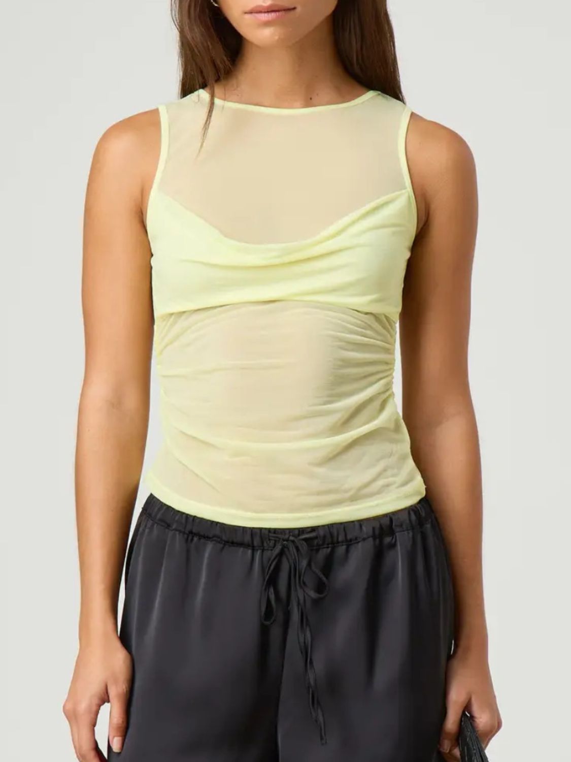 Ruched round neck tank top with semi-sheer design.