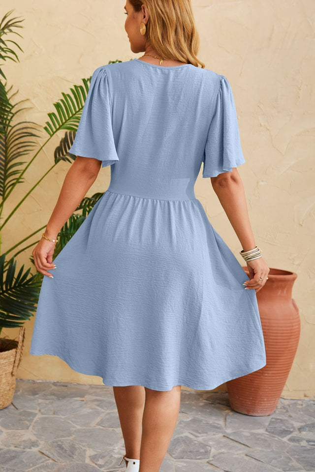 Ruched Surplice Short Sleeve Dress.