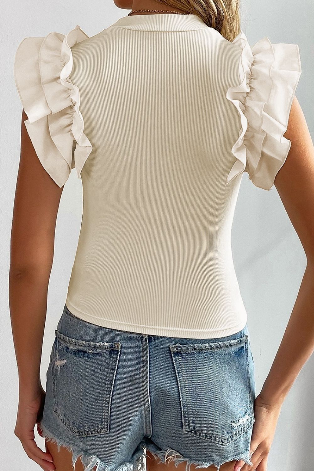 Ruffle Flutter Sleeve Mock Neck Ribbed Top.