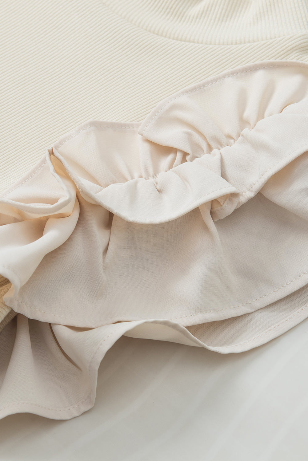 Ruffle Flutter Sleeve Mock Neck Ribbed Top.