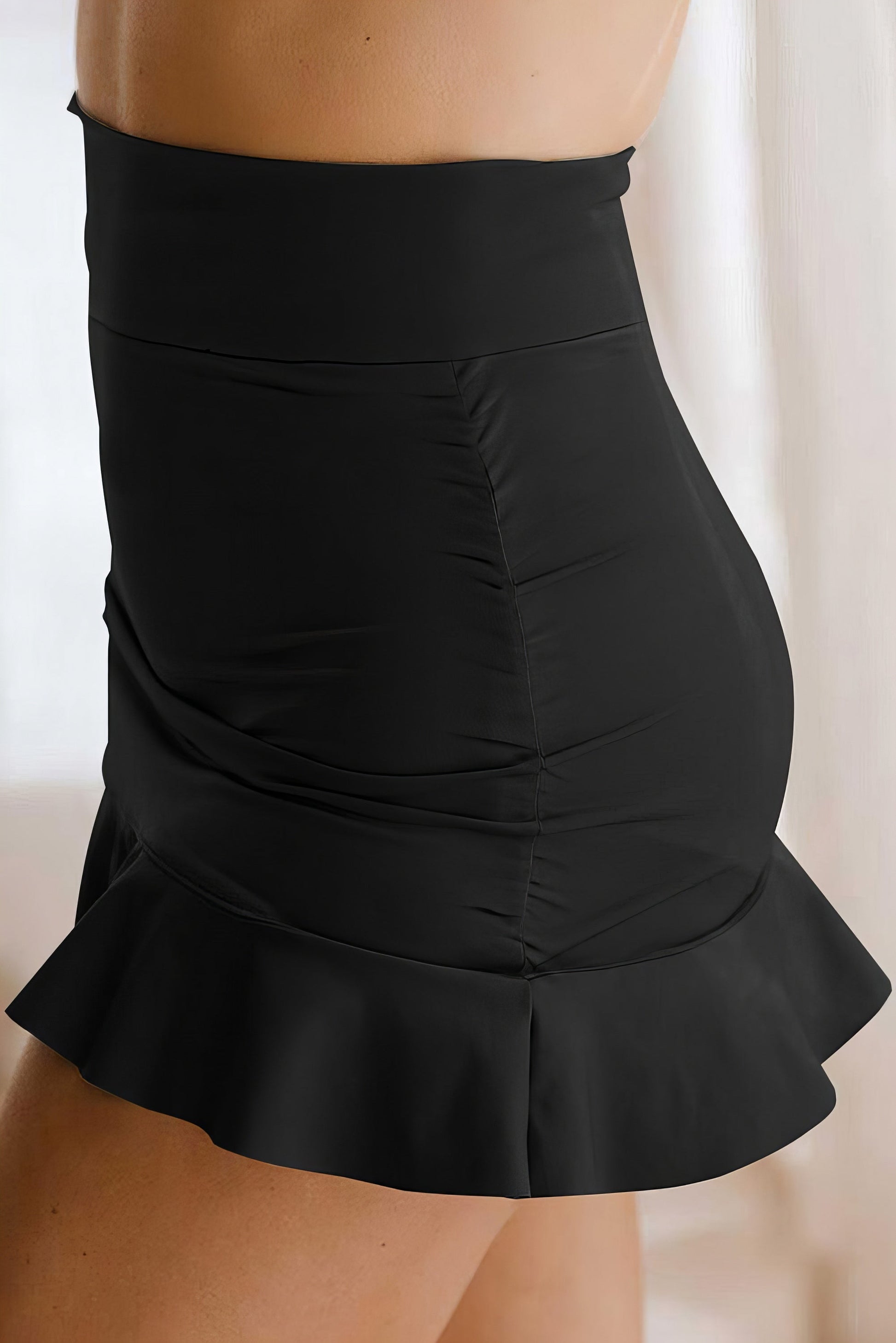 Black Ruffle Hem Swim Skort with Pockets. High-stretch beach style. Women's swimwear. Available in Black and Hot Pink.