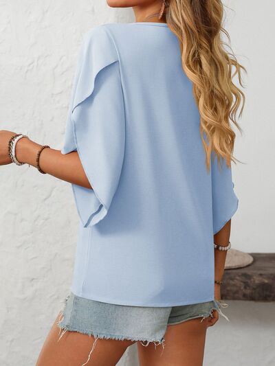 Mandy Ruffled Asymmetrical Neck Half Sleeve Blouse.