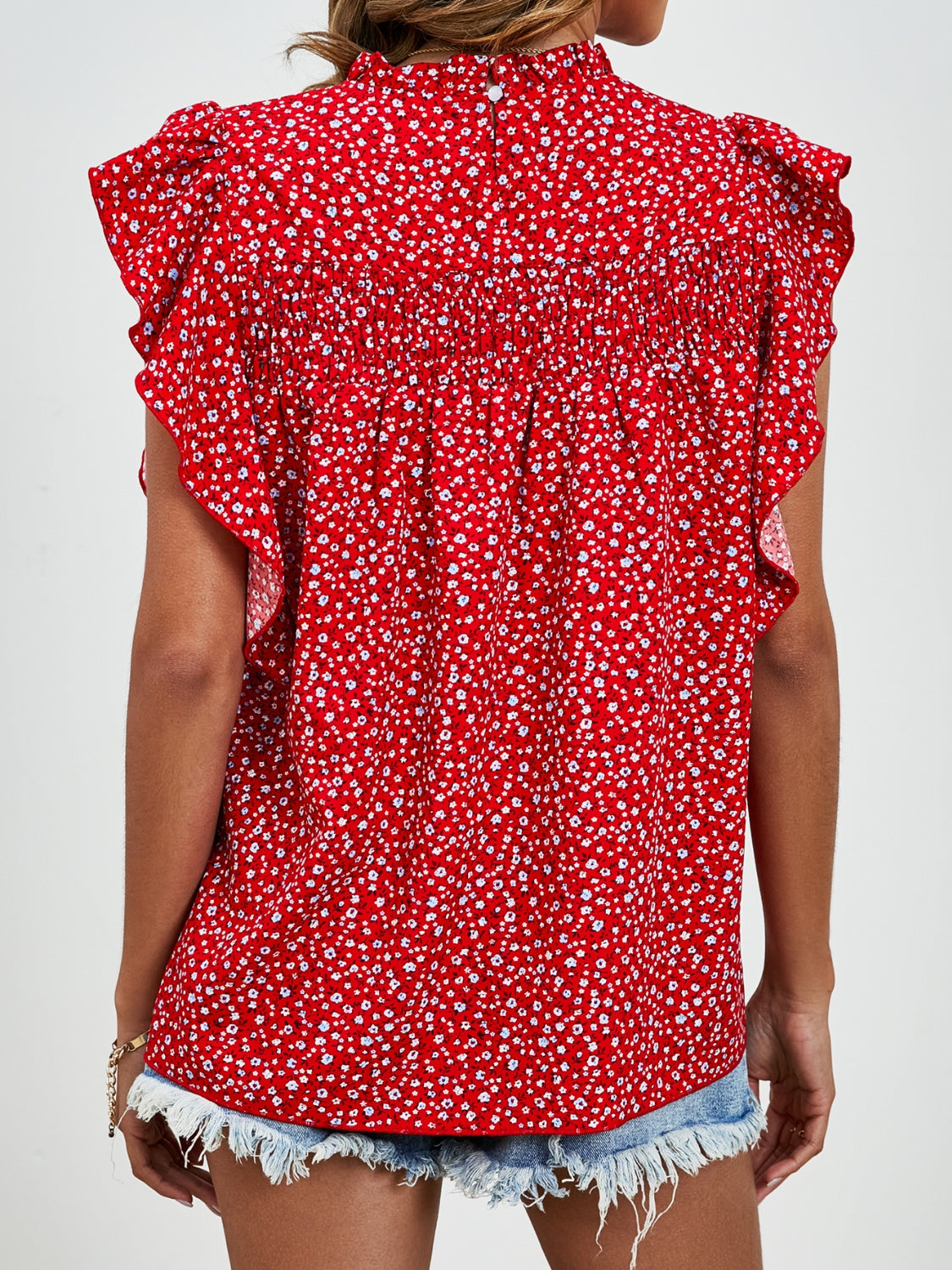 Ruffled Ditsy Floral Mock Neck Cap Sleeve Blouse.