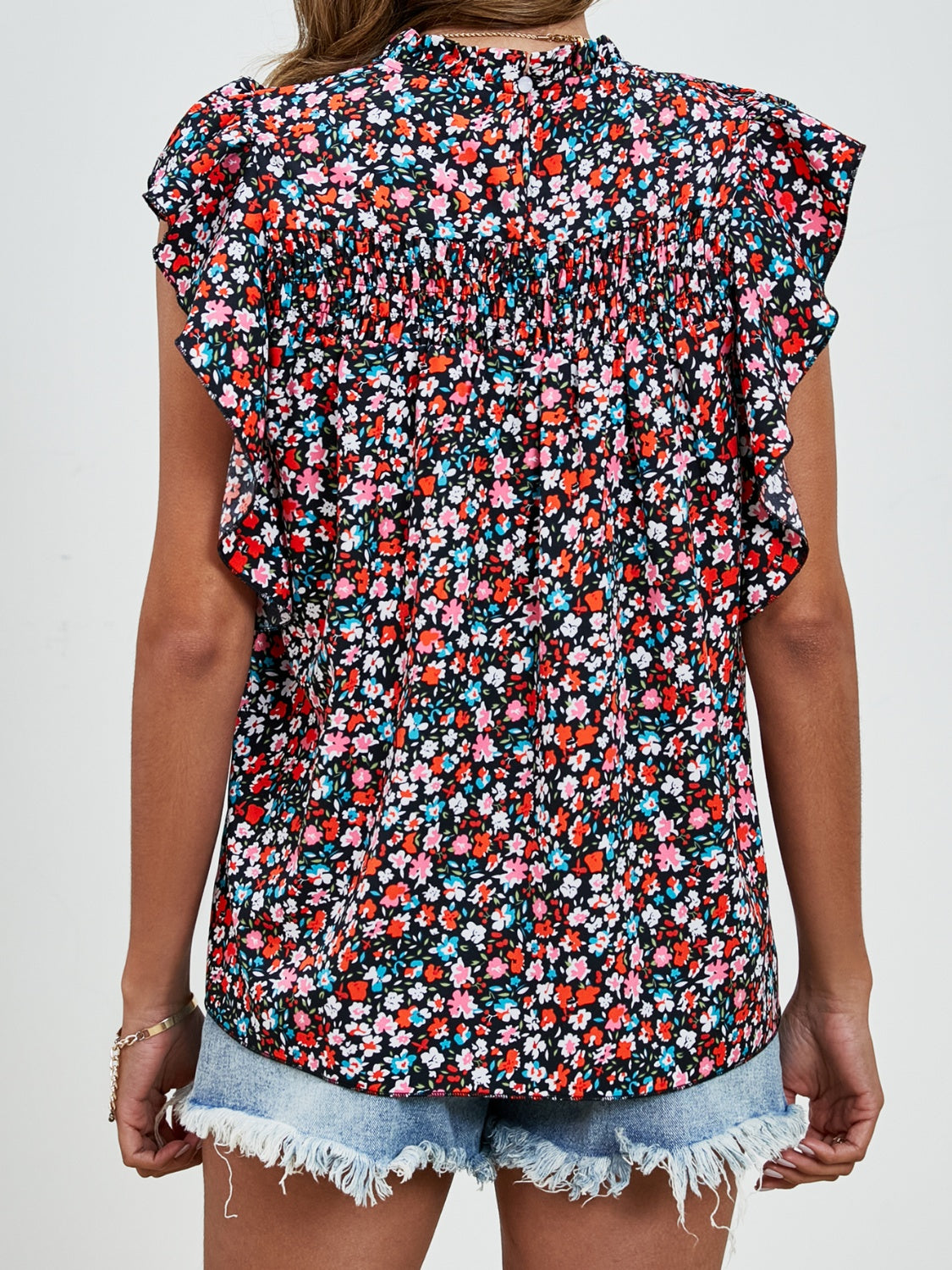 Ruffled Ditsy Floral Mock Neck Cap Sleeve Blouse.