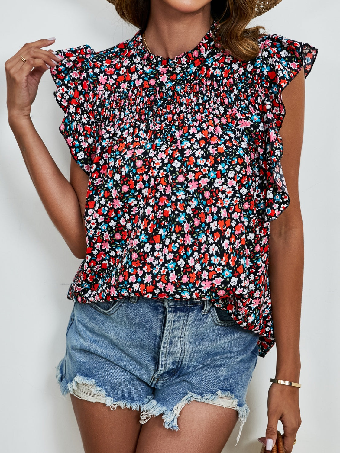 Ruffled Ditsy Floral Mock Neck Cap Sleeve Blouse.