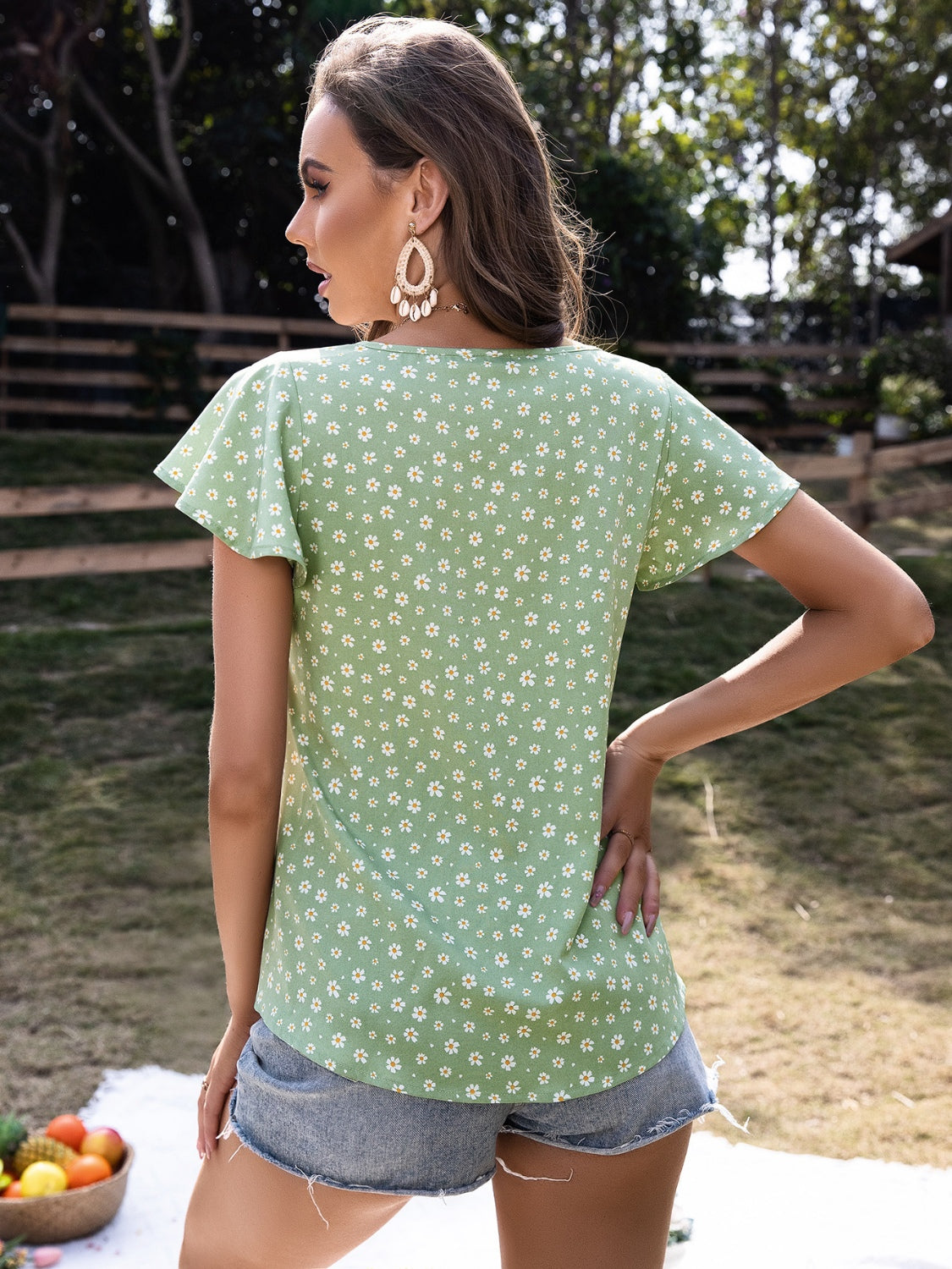 Ivy Lane Ruffled Floral Tie Neck Short Sleeve Blouse.