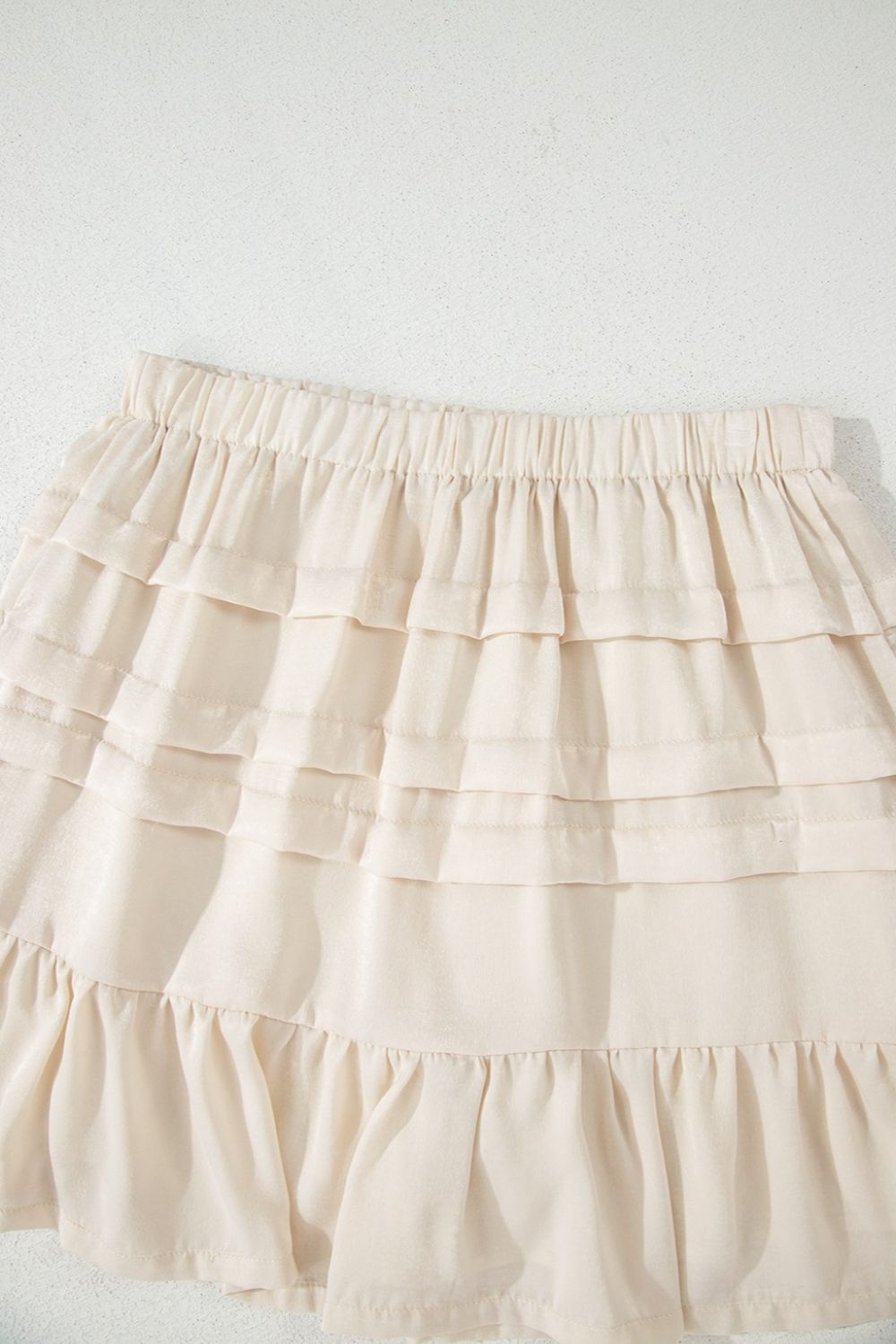 Ruffled Hemline Elastic Waist Mini Skirt.