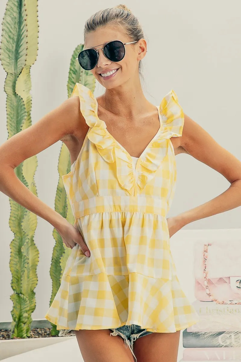 Ruffled neckline sleeveless check plaid peplum top.